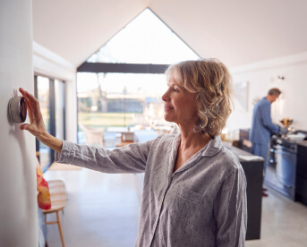 Woman using the Smart Home Device