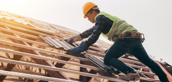 Professional contractor installing Traditional Tile Roofing